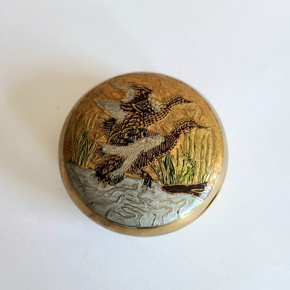 Vintage solid brass round jewelry/storage box with enamel birds/ducks design.